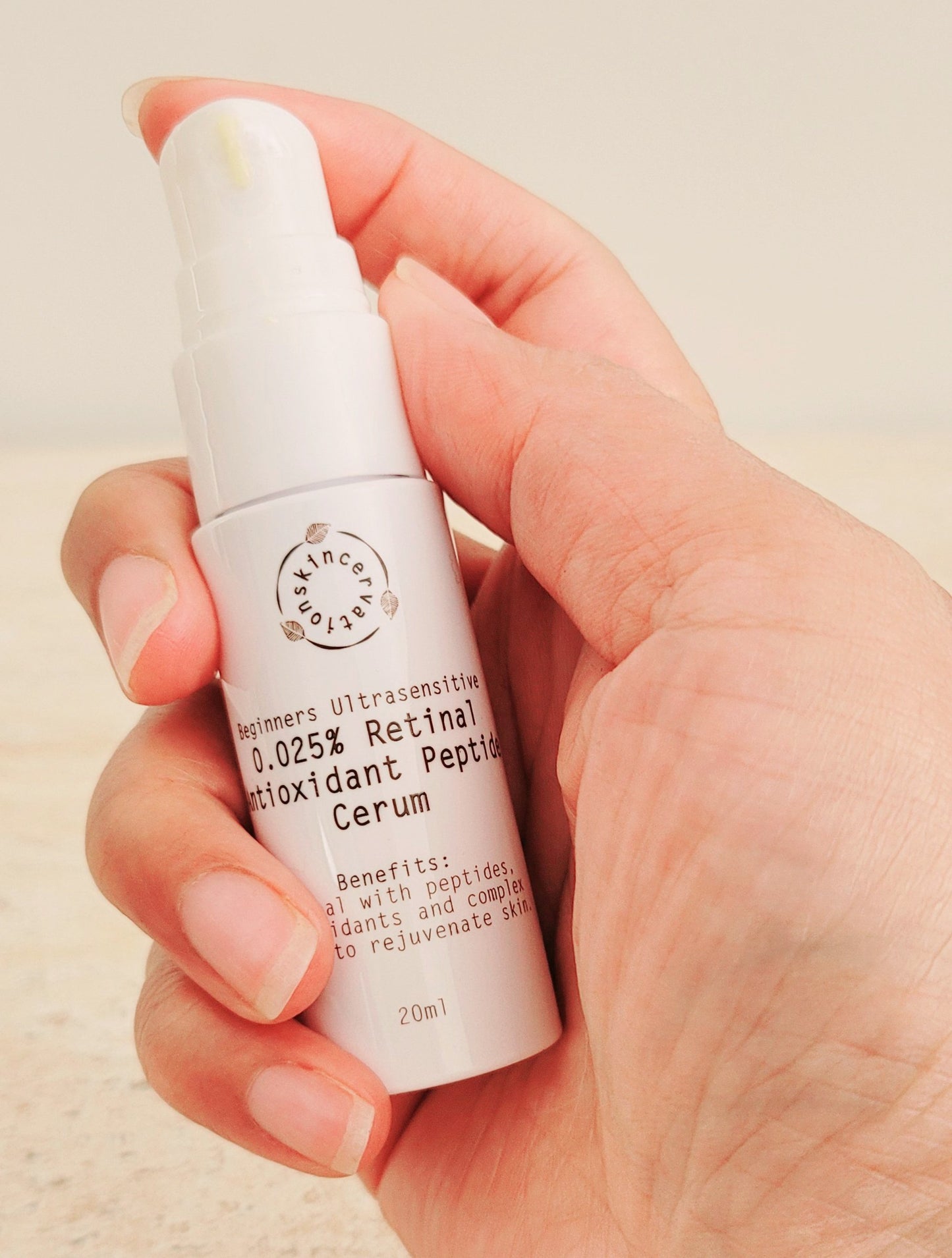 Hand holding Skincervation Ultra-sensitive Beginners Retinal Antioxidant Peptide Serum Travel Size