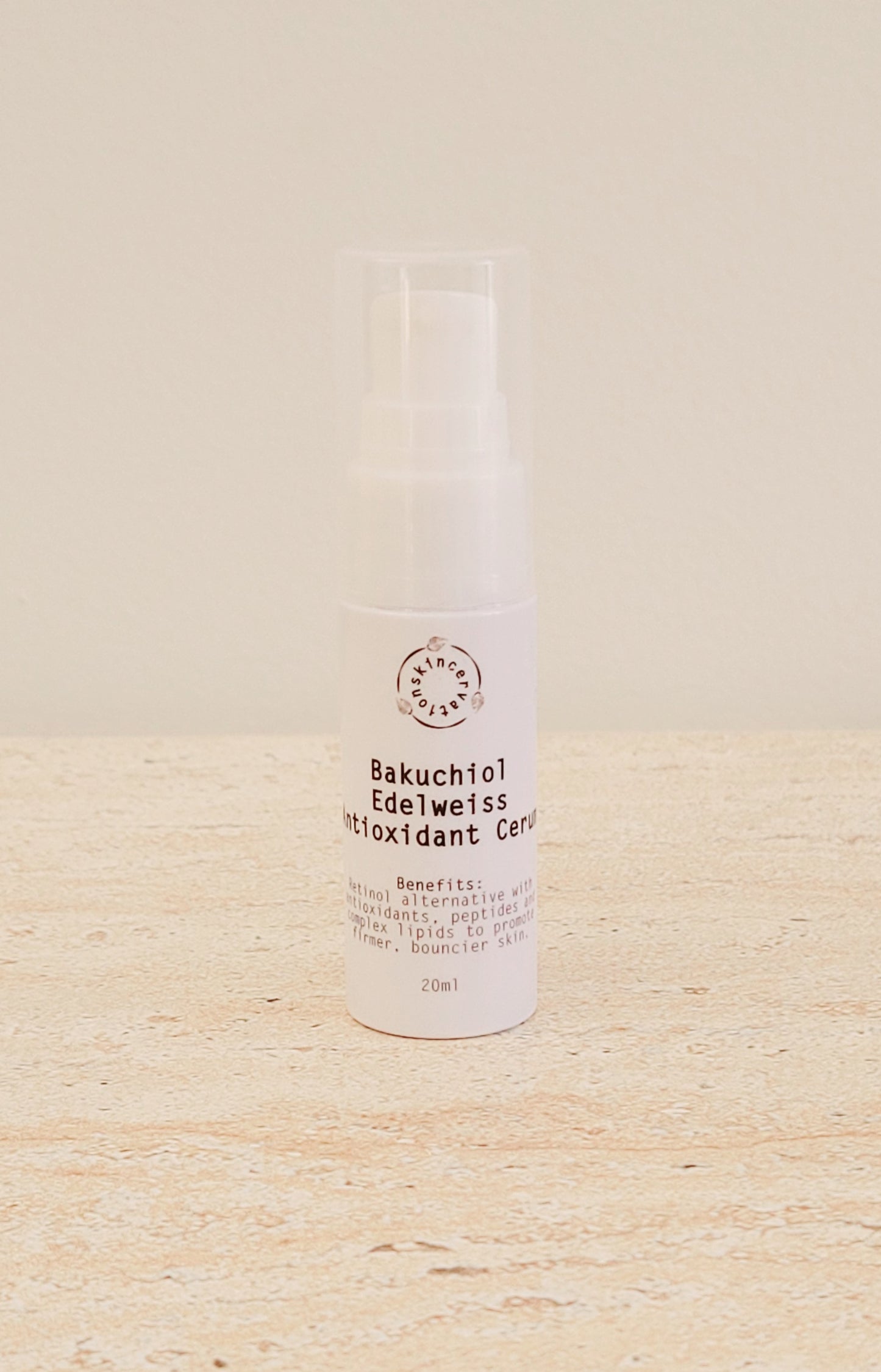 Skincervation Bakuchiol Edelweiss Antioxidant Cerum Serum in white pump bottle on beige surface