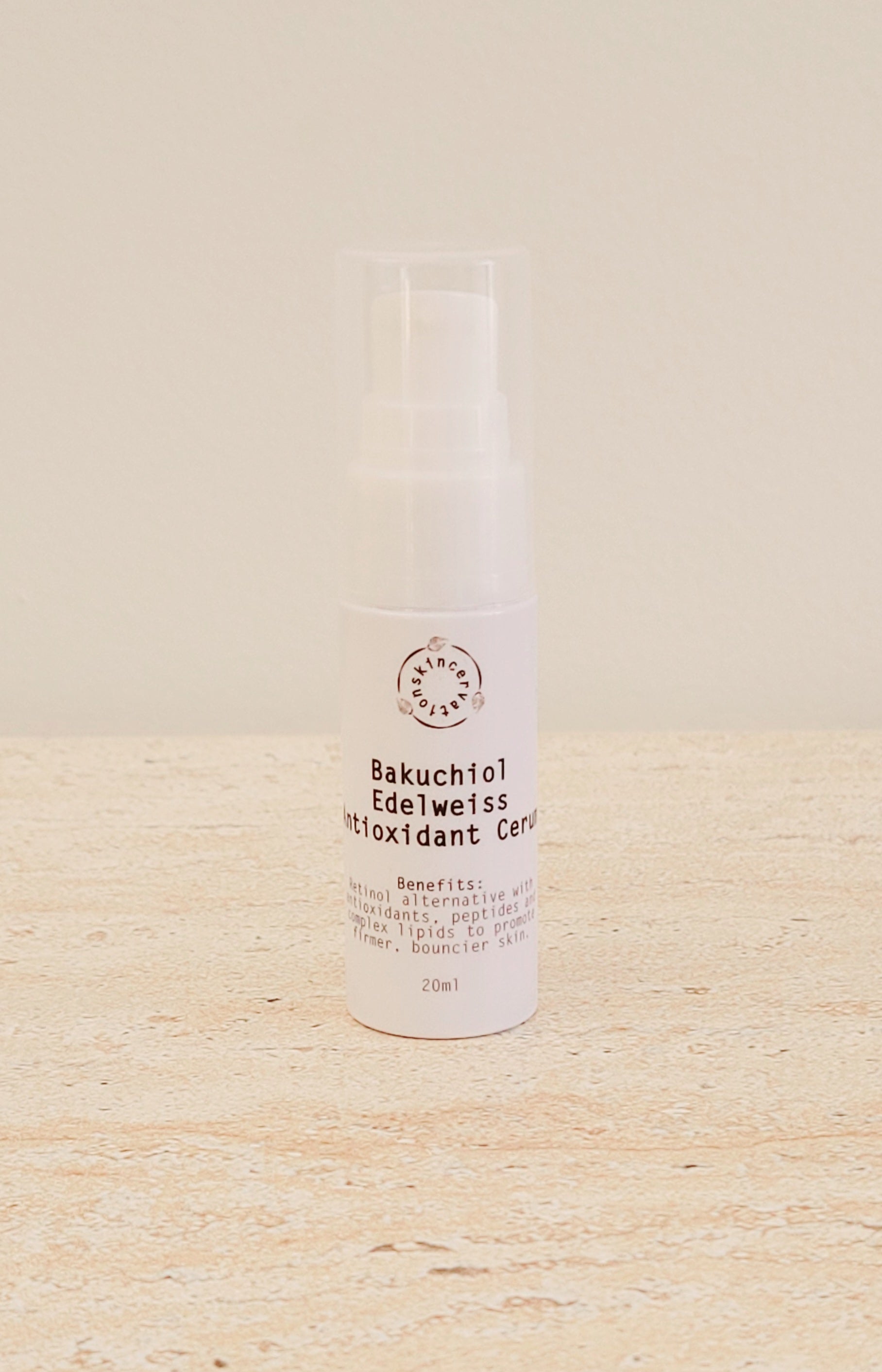 Skincervation Bakuchiol Edelweiss Antioxidant Cerum Serum in white pump bottle on beige surface